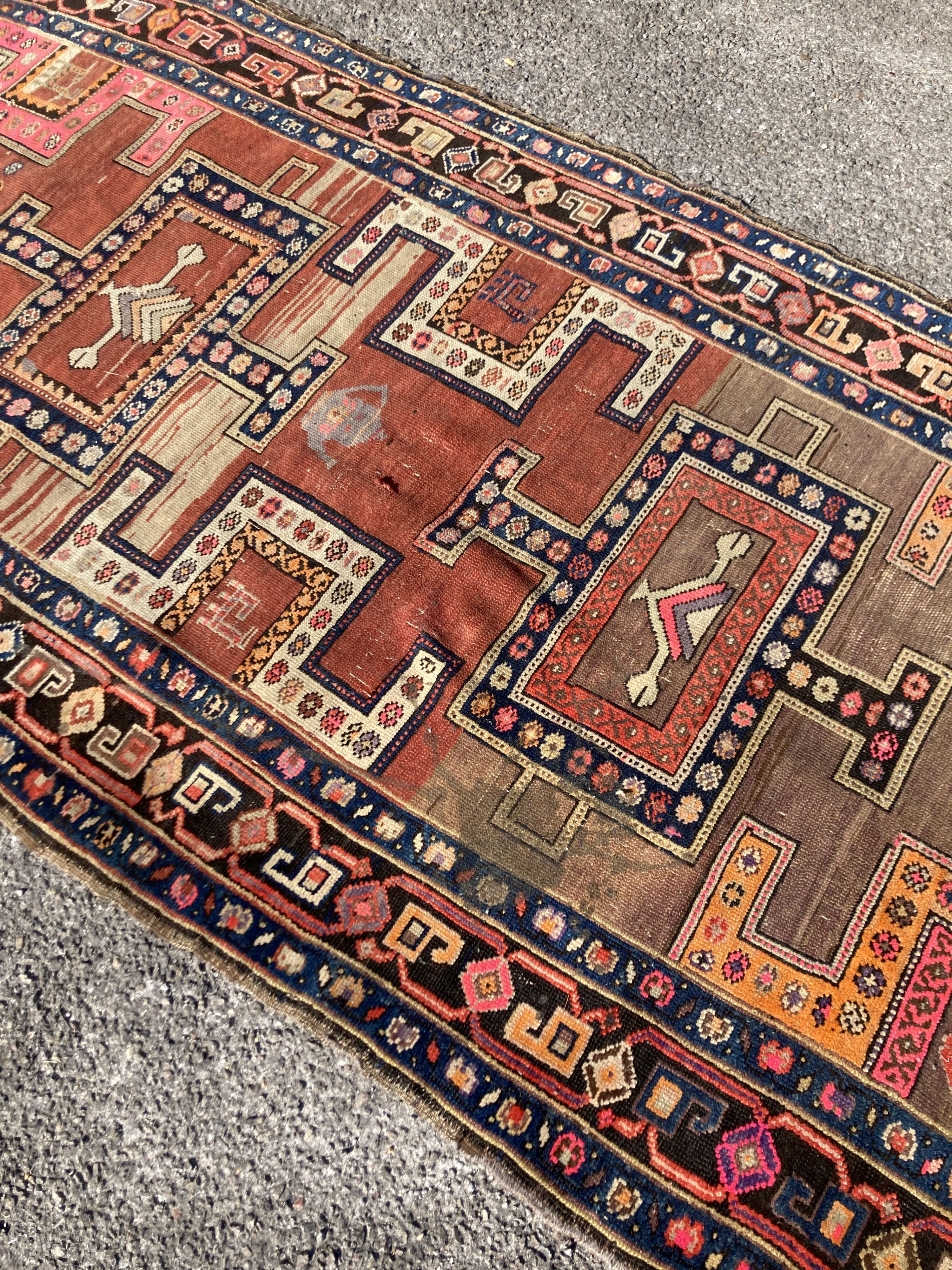 An early 20th century Caucasian Kazak hall carpet, 370 x 128cm